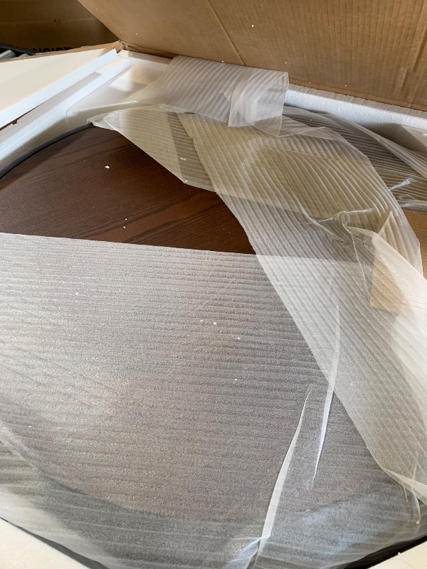 Photo 1 of Round Solid Wood Carved Coffee Table with Elegant Sculptural Design
