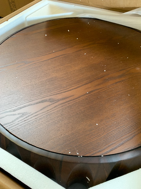 Photo 1 of Round Solid Wood Carved Coffee Table with Elegant Sculptural Design
