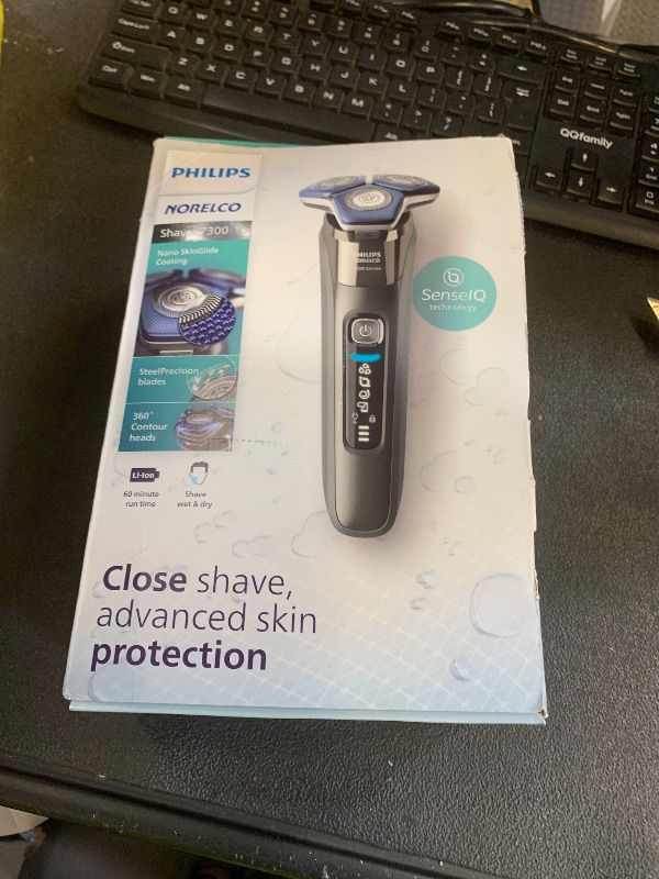 Photo 1 of Philips Norelco Shaver 7300, Rechargeable Wet & Dry Electric Shaver with SenseIQ Technology, Pop-up Trimmer, Charging Stand, Click-on Nose Trimmer, & Travel Case, S7887/92