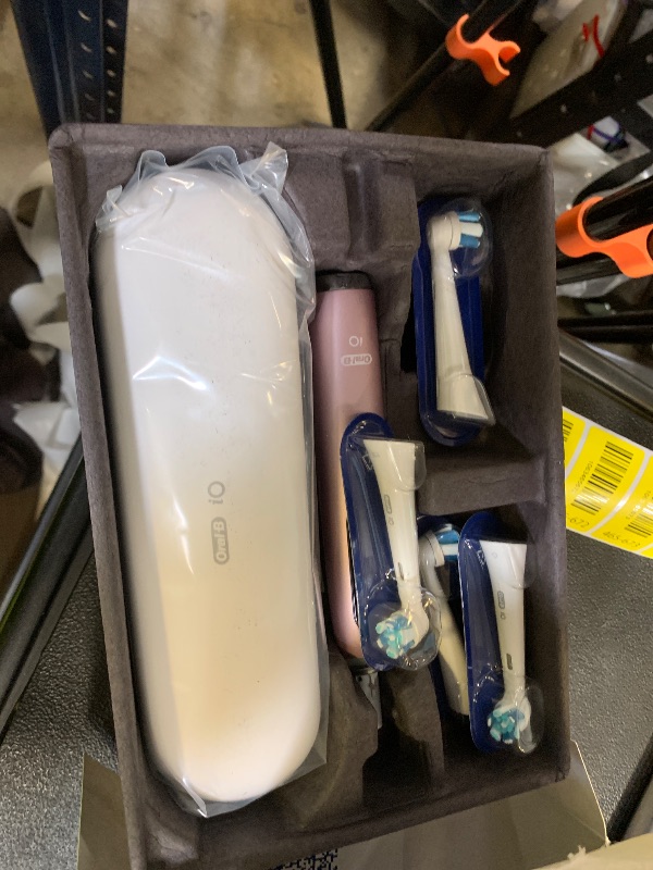 Photo 1 of Oral-B Rechargeable Electric Toothbrush, iO9 Genius, 7 Cleaning Modes, Interactive Display, Charging Travel Case, Visible Pressure Sensor, 4 Brush Heads, Rose Quartz