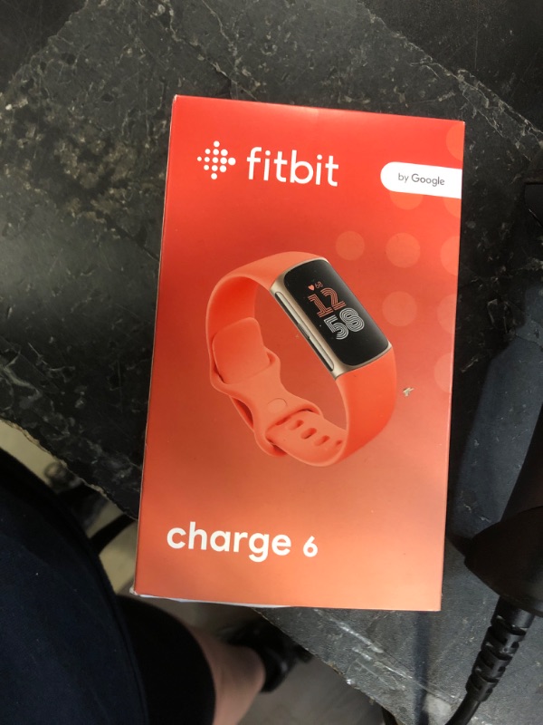 Photo 1 of Fitbit Charge 6 Fitness Tracker with Google apps, Heart Rate on Exercise Equipment, 6-Months Premium Membership Included, GPS, Health Tools and More, Gold/Coral, One Size (S & L Bands Included)