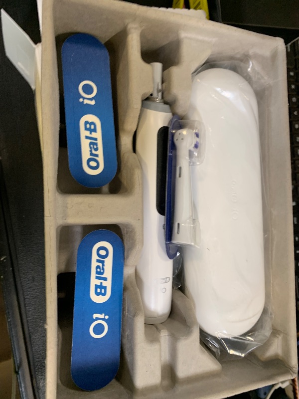 Photo 1 of Oral-B Rechargeable Electric Toothbrush, iO5 Limited Deep Clean & Whiten, 5 Cleaning Modes, Visual Pressure Sensor to Protect Gums, Travel Case, 3 Brush Heads, White
