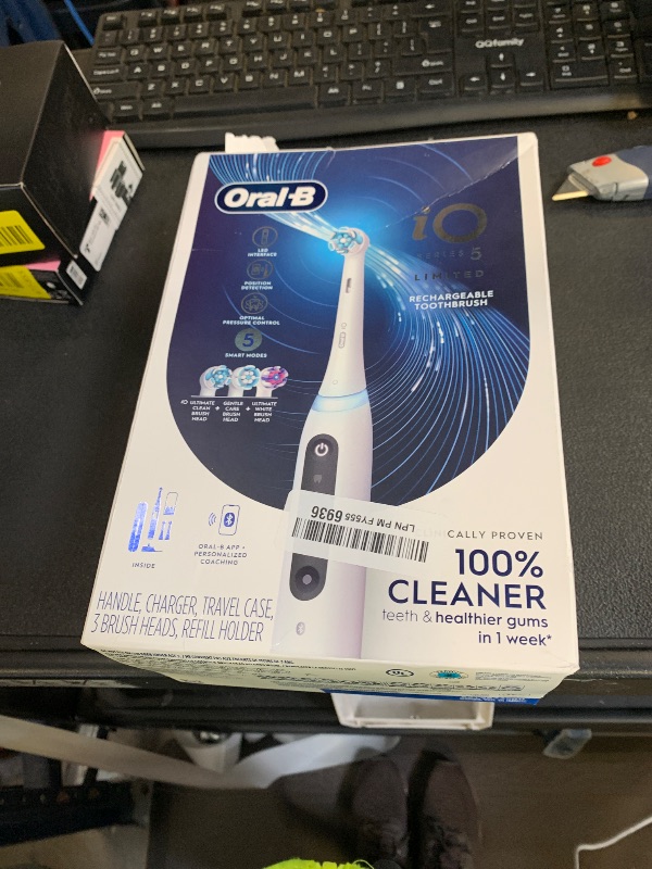 Photo 1 of Oral-B Rechargeable Electric Toothbrush, iO5 Limited Deep Clean & Whiten, 5 Cleaning Modes, Visual Pressure Sensor to Protect Gums, Travel Case, 3 Brush Heads, White