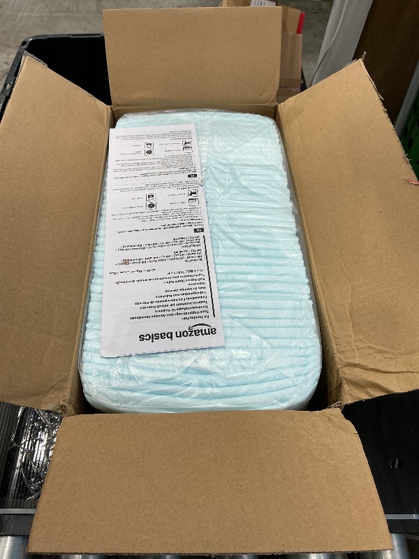 Photo 3 of Amazon Basics Puppy Pads with Quick-Dry 5-Layer Leak-Proof Design for Potty Training, X-Large Size 28 x 34 Inch, Pack of 40, Blue & White