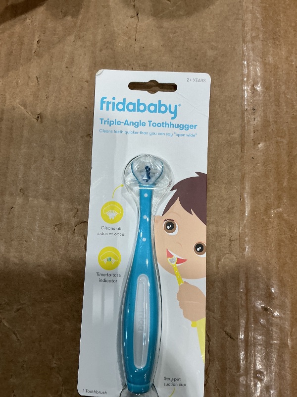 Photo 1 of Frida Baby Triple-Angle Toothhugger Training Toddler Toothbrush | Toddler Toothbrush 2 Years and Up, Cleans All Sides at Once | Blue