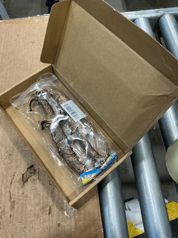 Photo 1 of **RETAIL PRICE: $9.99**
2 Pcs Plastic Dagger Fake Knife with Buckle for Wearing Over Pants Pirate Sword for Pirate Costume Accessories Prop Knife with Sheath Toy Knife Plastic Sword (Bronze)