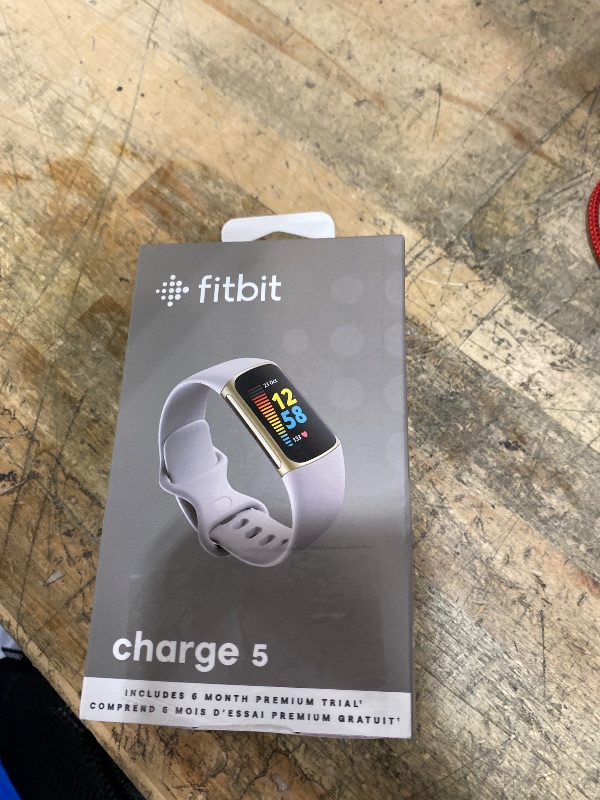 Photo 1 of **ITEM FACTORY SEALED** Fitbit Charge 5 Advanced Health & Fitness Tracker with Built-in GPS, Stress Management Tools, Sleep Tracking, 24/7 Heart Rate and More, Lunar White/Soft Gold, One Size (S &L Bands Included)