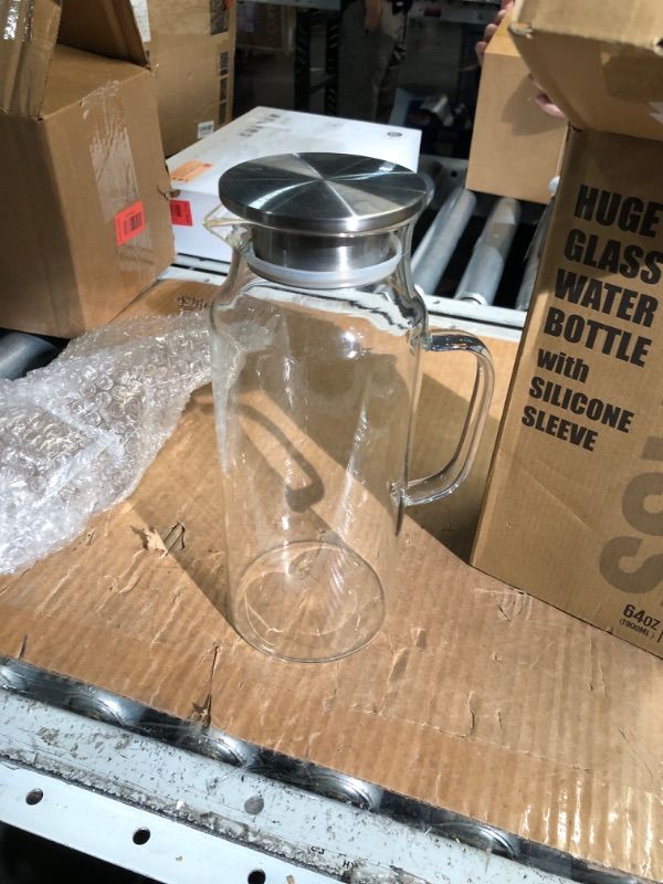 Photo 1 of (Silicone Sleeve is missing) chunmo 64oz Glass Water Bolttles with Straw Half Gallon Large Motivational Water Bottle with Time Marker Sports Water Bottles with Silicone Sleeve and Handle Lid Water Jug for Gym Workout