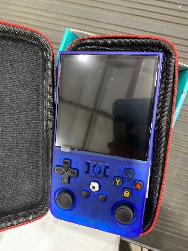 Photo 1 of ?R36MAX 4000mAh Portable Rechargeable Handheld Retro Game Console,Comfort Non-Slip Handheld Standing Retro Game Console with 64G TF Car,4.0-inch Screen,for Office,Blue
