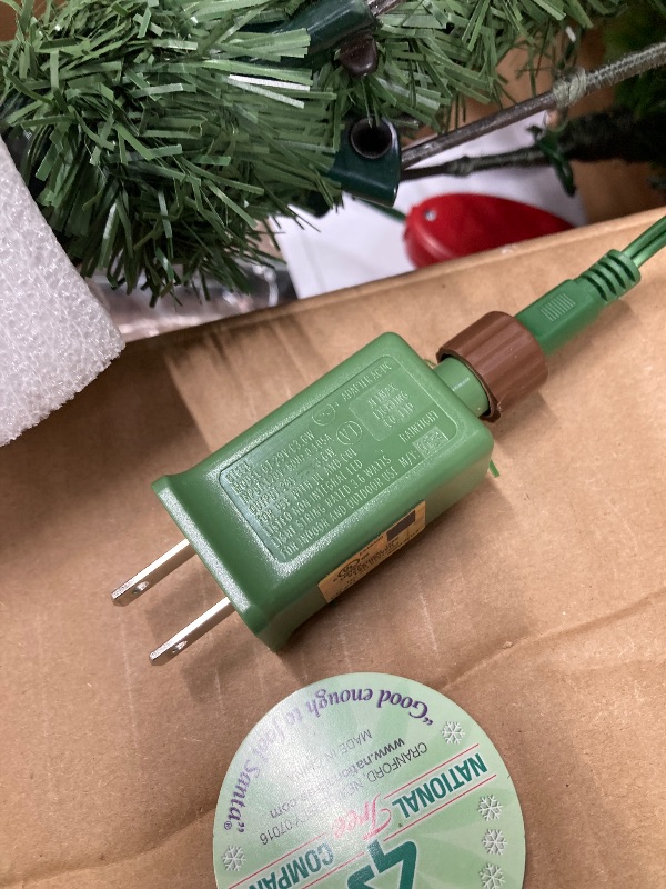 Photo 1 of ***DAMAGED - SELLING AS IS *** 
National Tree Company Artificial Christmas Tree | Includes Pre-strung Multi-Color LED Lights, PowerConnect and Stand | Kingswood Fir Slim - 7 Feet