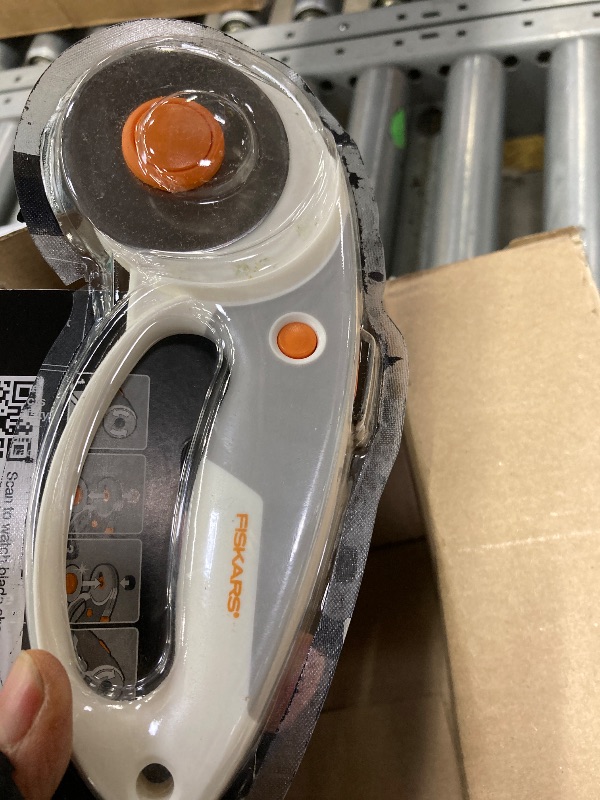 Photo 1 of ***used***Fiskars 60mm Rotary Cutter for Fabric with Ergonomic Loop Grip And Comfort Handle, Titanium Rotary Fabric Cutter for Thick Materials, Easy and Safe Blade Change, Sewing Supplies and Quilting Tools