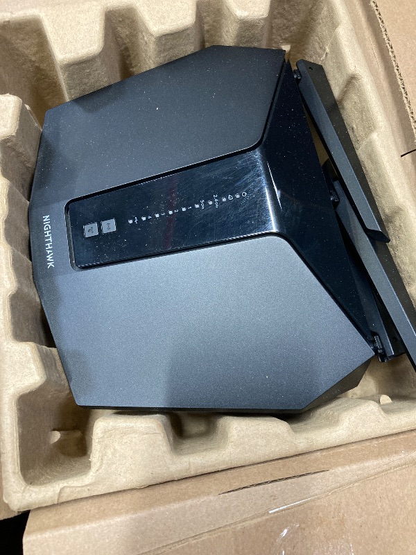 Photo 1 of **IT IS USED, MISSING A PART AND IT IS UNKNOWN IF IT IS 100% FUNCTIONAL****NETGEAR Nighthawk WiFi 6 Router (RAX30) - Security Features, 5-Stream Dual-Band Gigabit Router, AX2400 Wireless Speed (Up to 2.4 Gbps), Covers Up to 2,000 sq.ft. and 20 Devices