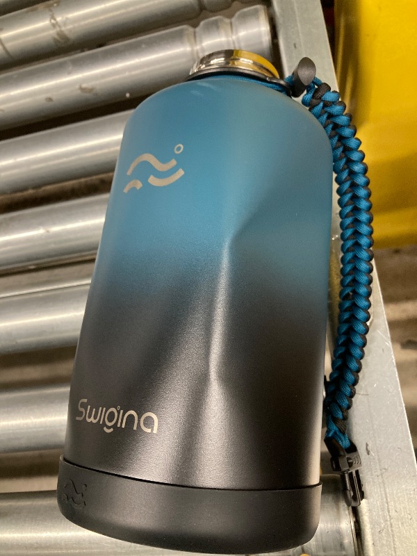 Photo 1 of ***DAMAGED DENTED-SELLING AS IS***

Swigina [2-IN-1 LID] 64 oz Insulated Water Bottle with Silicone Boot (48hrs Cold/24hrs Hot) - DIY Stickers, Leakproof, BPA Free, Half Gallon
