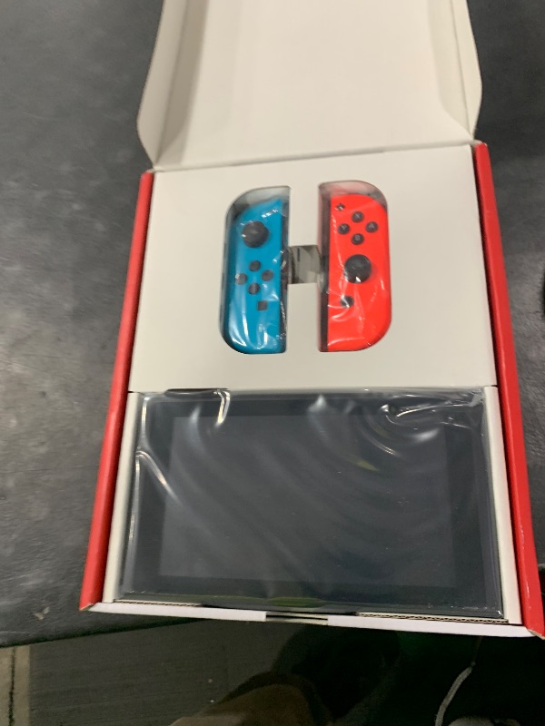 Photo 1 of Nintendo Switch with Neon Blue and Neon Red Joy-Con - Handheld Gaming Console