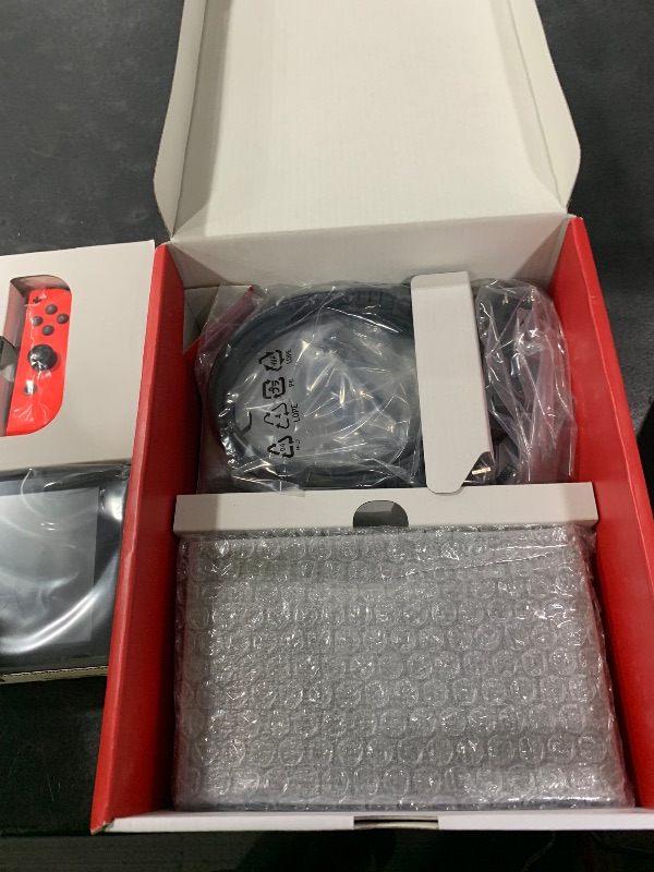 Photo 1 of Nintendo Switch with Neon Blue and Neon Red Joy-Con - Handheld Gaming Console