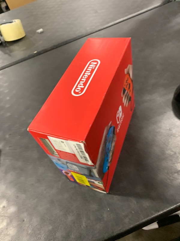 Photo 1 of Nintendo Switch with Neon Blue and Neon Red Joy-Con - Handheld Gaming Console