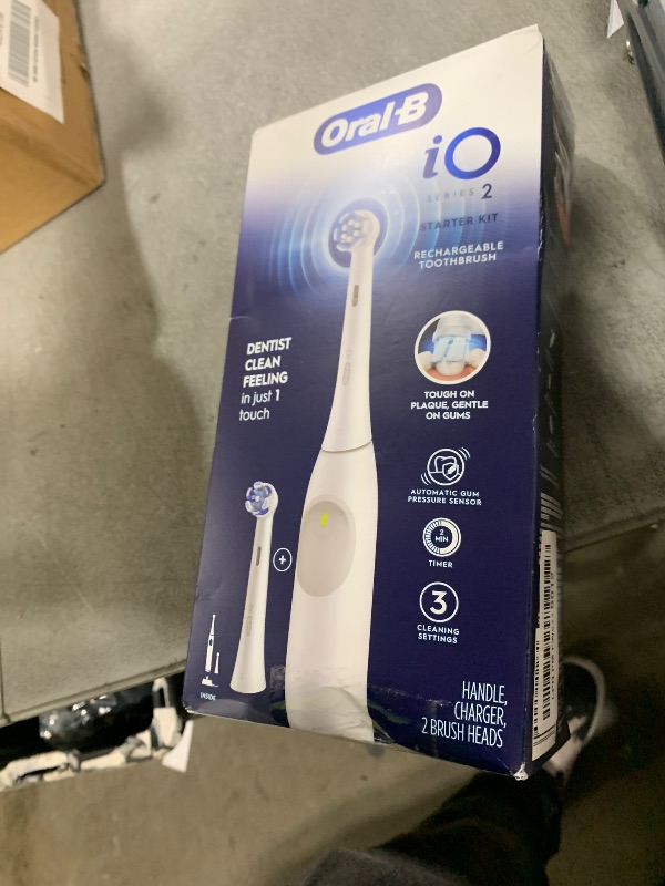 Photo 1 of **USED, INCOMPLETE** Oral-B iO Series 2 Rechargeable Electric Powered Toothbrush Starter Kit, Pure White with 2 Brush Heads - Automatic Pressure Sensor to Protect Gums - 3 Modes - 2 Min Timer