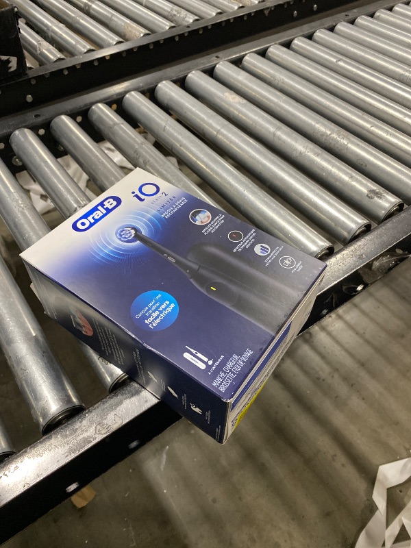 Photo 1 of Oral-B iO Simple Clean Rechargeable Electric Powered Toothbrush, Night Black with 1 Gentle Care Brush Head and 1 Black Travel Case - Automatic Pressure Sensor to Protect Gums - 3 Modes - 2 Min Timer