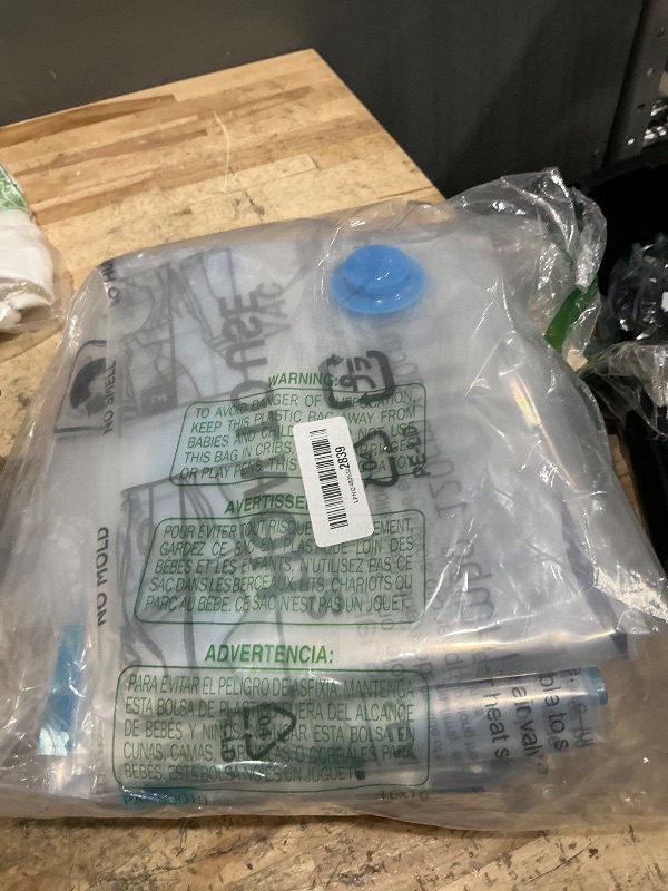 Photo 1 of Amazon Basics Vacuum Compression Space Saving Storage Bags with Hand Pump for Clothes Packing, Pack of 15, Multiple Sizes, White