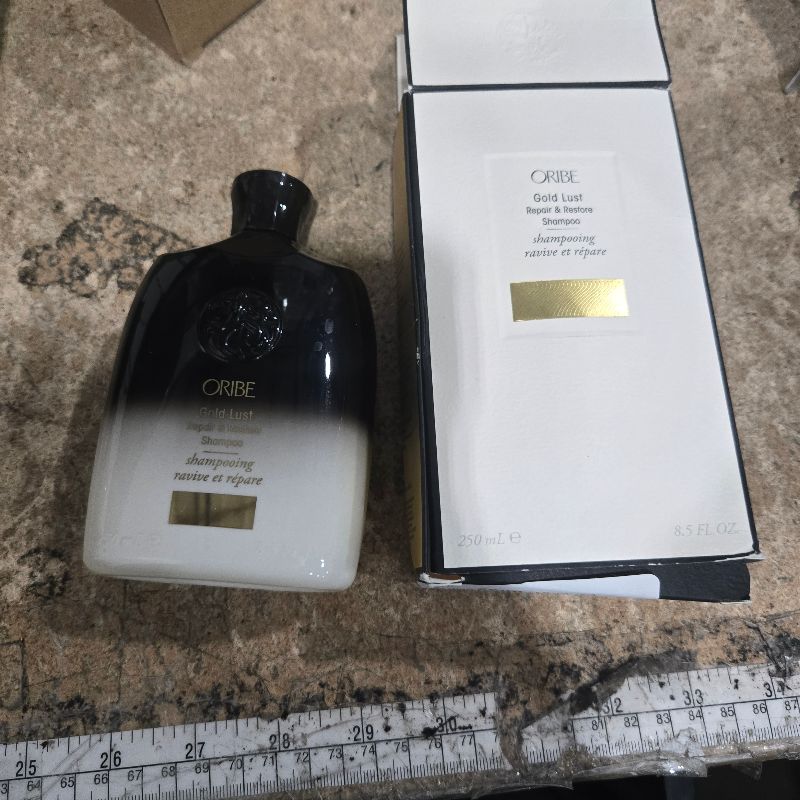 Photo 1 of **HALF FULL** Oribe Gold Lust Repair & Restore Shampoo, 8.5 oz