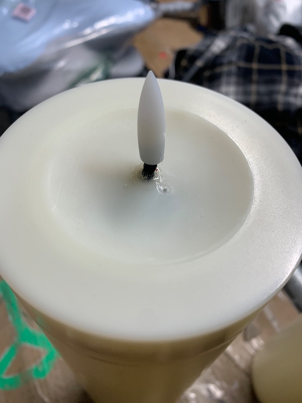 Photo 1 of ***(PARTS ONLY/ MINOR DAMAGE/ MISSING REMOTE)***14" x 4" Large Flameless Candles with Remote & Timer, Waterproof Outdoor Battery Operated Candles LED Electric Flickering Flameless Pillar Candle for Patio Porch Lanterns Home Decor, Set of 2