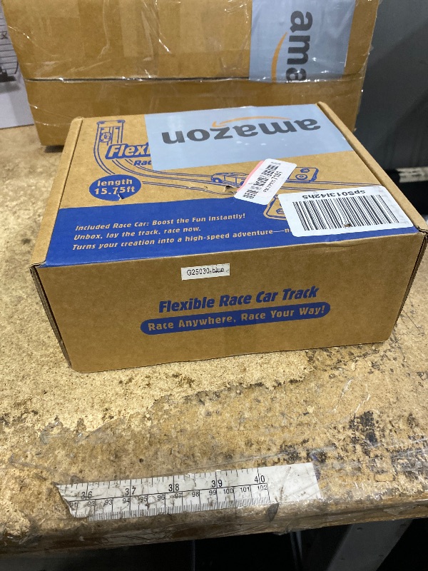 Photo 1 of 15.75 Ft Flex Track for Kids, Flexible Race Track Compatible with Hot Wheels and Diecast 1/64th Cars, Roll-Up Portable Race Car Ramp Track with Suction Cups & Track Anchors & 4 Race Cars, Blue