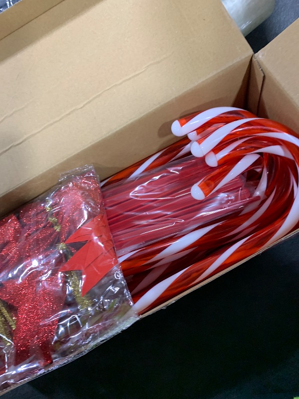 Photo 1 of Christmas Candy Cane Pathway Lights, 24PCS 240 LED Christmas Lights Outdoor Decorations with Red Bow Waterproof, 8 Modes Timer Remote Walkway for Xmas Home Yard Lawn Patio Decor