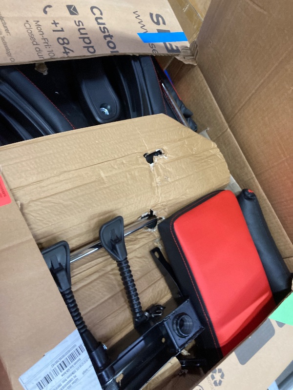 Photo 1 of ***The model may vary****
 110 Racing Style Gaming Chair, Reclining Ergonomic Leather Chair with Footrest, in Red (RSP-110-RED)
