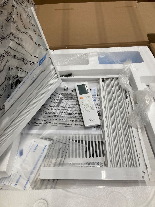 Photo 1 of *Dirty* Midea 12,000 BTU Smart Inverter Air Conditioner Window Unit with Heat and Dehumidifier – Cools up to 550 Sq. Ft., Energy Star Rated, Quiet Operation, Electronic Controls, Remote Control, White