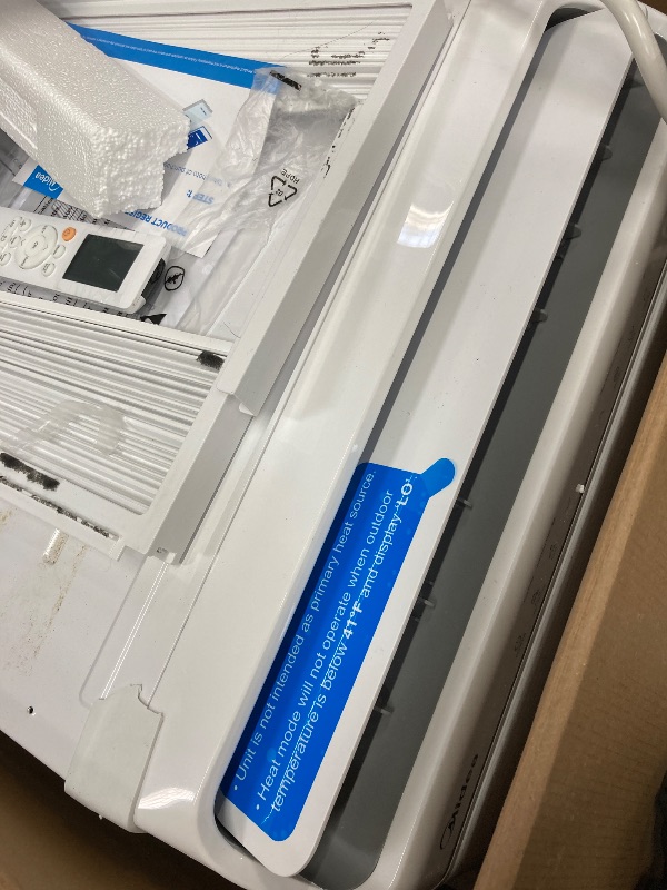 Photo 1 of *Dirty* Midea 12,000 BTU Smart Inverter Air Conditioner Window Unit with Heat and Dehumidifier – Cools up to 550 Sq. Ft., Energy Star Rated, Quiet Operation, Electronic Controls, Remote Control, White