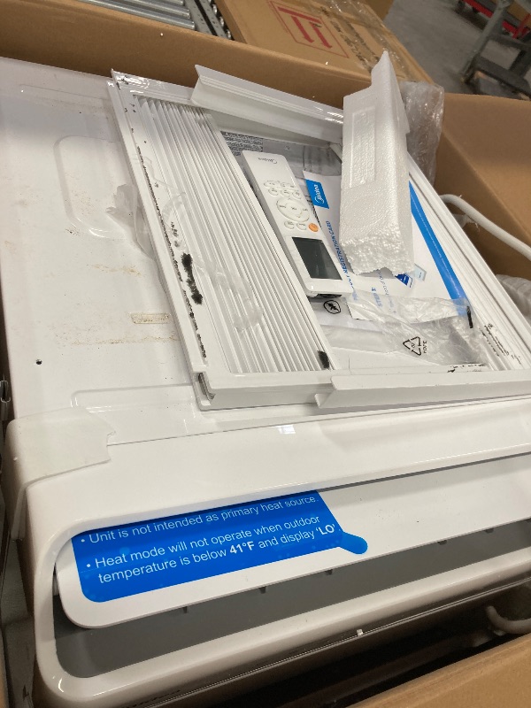 Photo 1 of *Dirty* Midea 12,000 BTU Smart Inverter Air Conditioner Window Unit with Heat and Dehumidifier – Cools up to 550 Sq. Ft., Energy Star Rated, Quiet Operation, Electronic Controls, Remote Control, White
