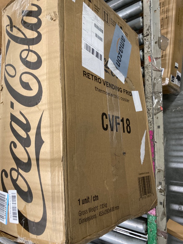 Photo 1 of *MAJOR DAMAGE*
Coca-Cola AC/DC Retro Vending Electric Cooler with 10 Can Capacity - Beverage Vending Machine with Thermoelectric Cooling and Tall Window Display