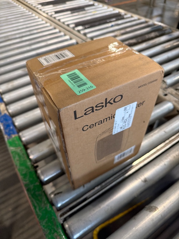 Photo 1 of ** SOLD AS IS, NO REFUND/RETURN** SEE COMMENTS!
 Lasko CD09250 Ceramic Adjustable Thermostat Tabletop or Under-Desk Heater, 9 Inches High, Black