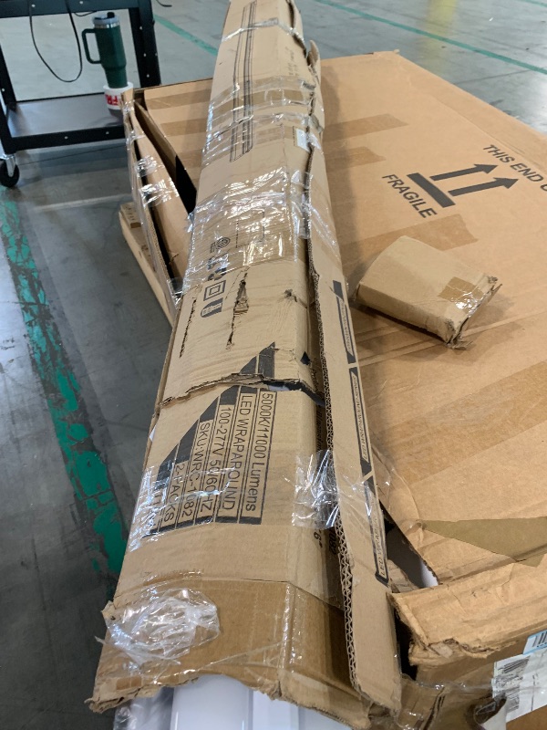 Photo 1 of  ***ONE IS HEAVILY DAMAGED, OTHER LIGHT IS SLIGHTLY BENT, SELLING AS IS FOR PARTS, FINAL SALE***hykolity 110W 8FT LED Shop Lights Ultra Slim LED Wraparound, 12600lm 5000K LED Strip Lights, 8 Foot Flush Mount Warehouse Garage Office Ceiling Light Fixture, 