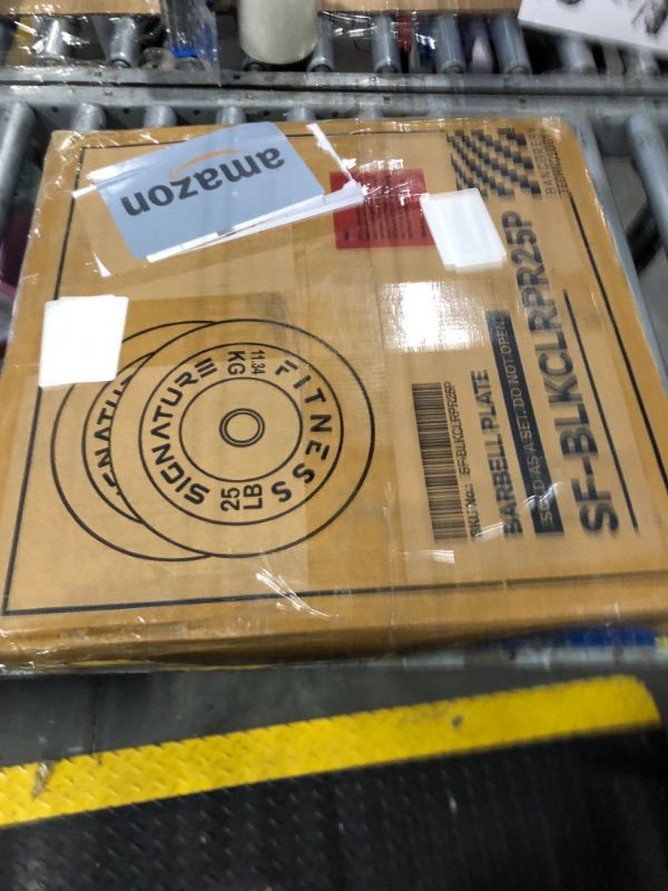 Photo 1 of **2 10lb plates only**