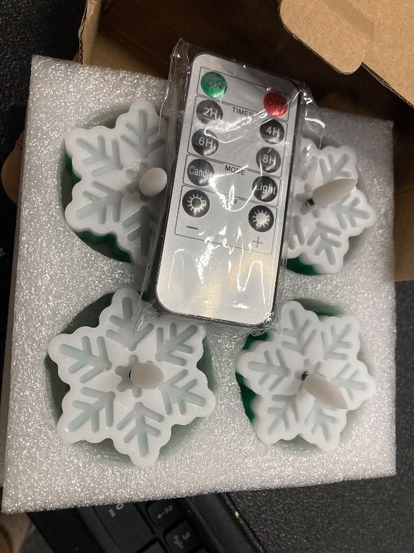 Photo 1 of ***POSSIBLY NEED BATTERIES REPLACED***Girimax Snowflakes Flameless Wax Tealights with Remote Timer, Green White Christmas LED Tea Votive Candles Battery Operated, Set of 4***POSSIBLY NEED BATTERIES REPLACED***