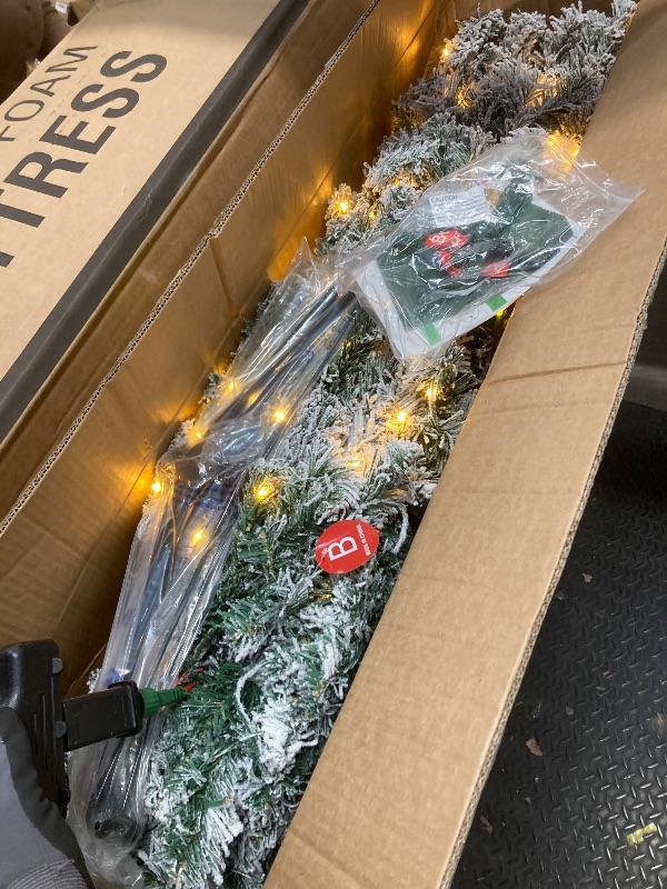 Photo 1 of *Size unknown* Pre-lit Flocked Christmas Tree