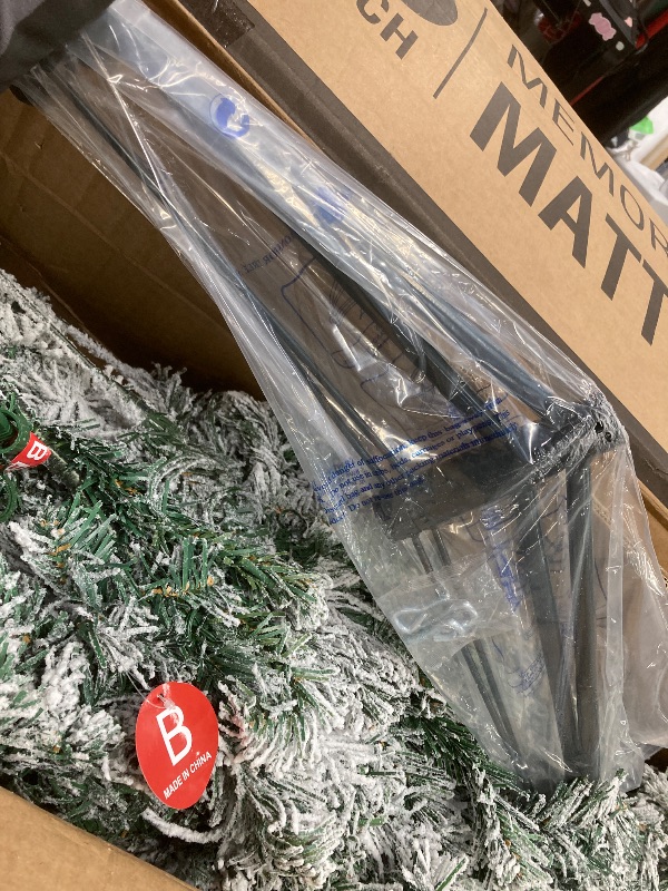 Photo 1 of *Size unknown* Pre-lit Flocked Christmas Tree