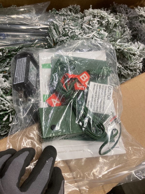 Photo 1 of *Size unknown* Pre-lit Flocked Christmas Tree