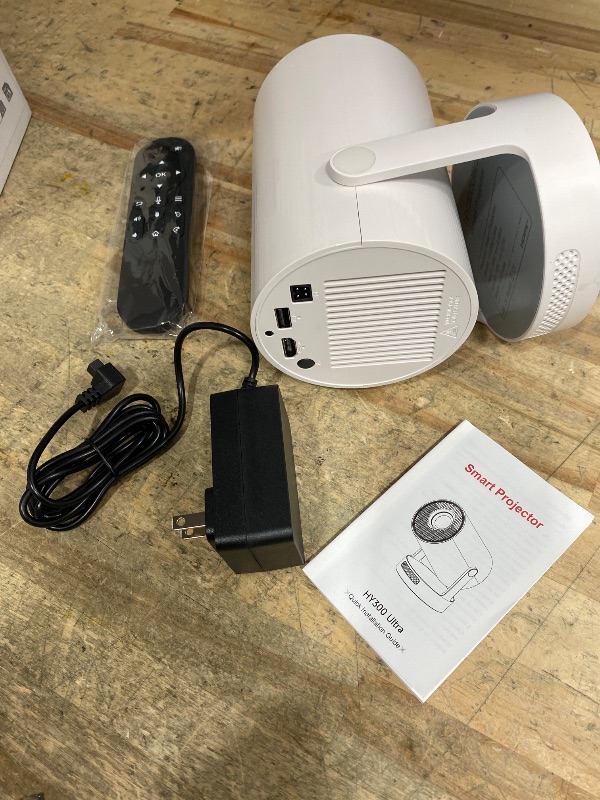 Photo 1 of ?Electric Focus?Mini Projector with WiFi 6 and Bluetooth 5.4, Smart Portable Projector 4k Support, 5W Soundbase Speaker, Auto Keystone 180° Rotation, Home Outdoor Movie Proyector HY300Ultra