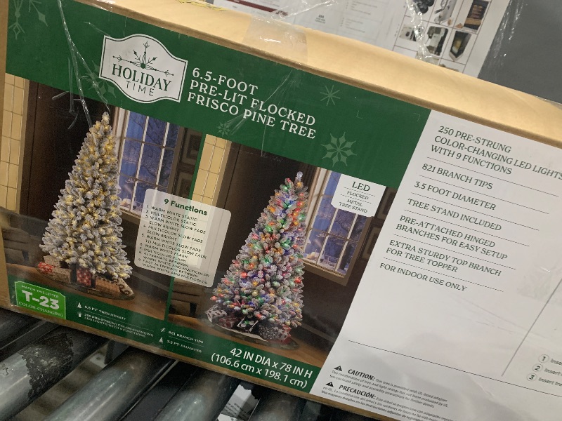 Photo 1 of **********INCOMPLETE, MISSING A SECTION OF THE TREE***************
6.5 Ft Pre- Flocked Frisco Pine Artificial Christmas Tree with 250 Color-Changing LED Lights and Stand, by Holiday Time