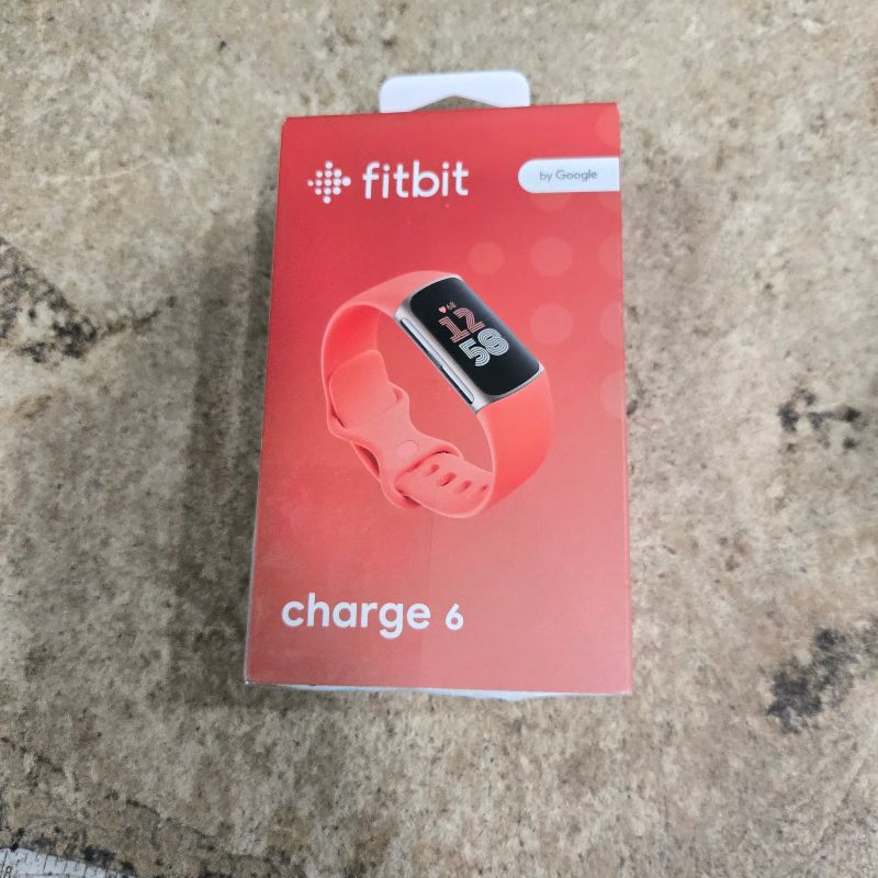 Photo 1 of **No Charger** Fitbit Charge 6 Fitness Tracker with Google apps, Heart Rate on Exercise Equipment, 6-Months Premium Membership Included, GPS, Health Tools and More, Gold/Coral, One Size (S & L Bands Included)