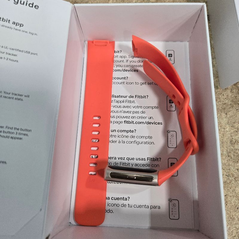 Photo 1 of **No Charger** Fitbit Charge 6 Fitness Tracker with Google apps, Heart Rate on Exercise Equipment, 6-Months Premium Membership Included, GPS, Health Tools and More, Gold/Coral, One Size (S & L Bands Included)