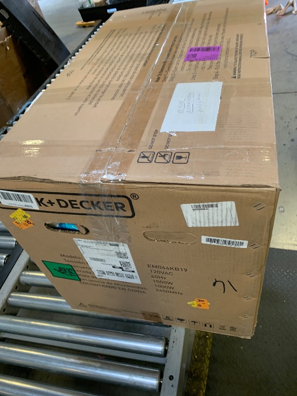 Photo 1 of BLACK+DECKER EM044KB19 Over The Range Microwave Oven with One Touch, 1000 Watts, 400 CFM and Auto Cooking, OTR 1.9 Cu.ft