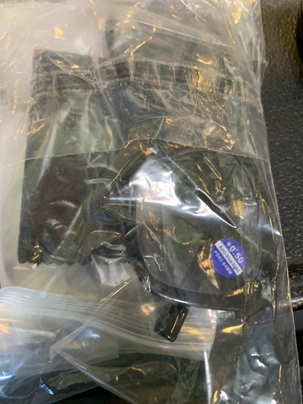 Photo 1 of black reading glasses with different frames to pop lenses in