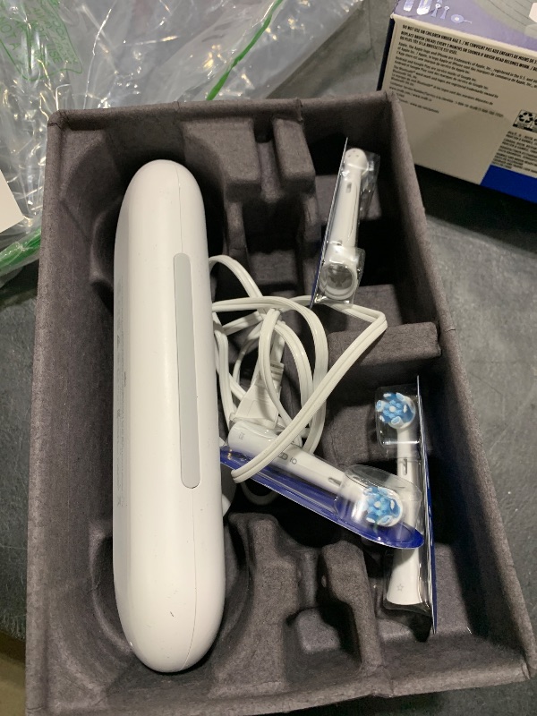 Photo 1 of Oral-B iO Series 9 Electric Toothbrush with 3 Replacement Brush Heads, White Alabaster