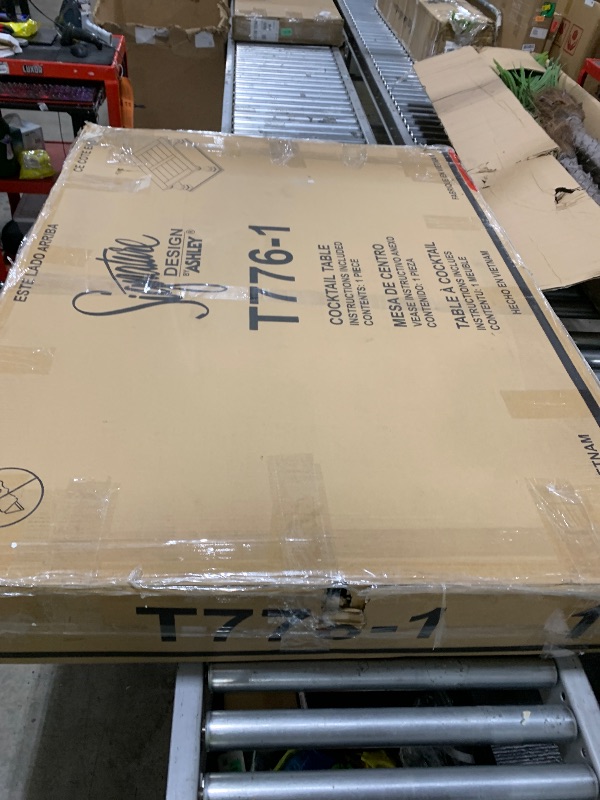 Photo 1 of Signature Design by Ashley Johnelle Farmhouse Coffee Table with Weathered Gray Finish, Gray