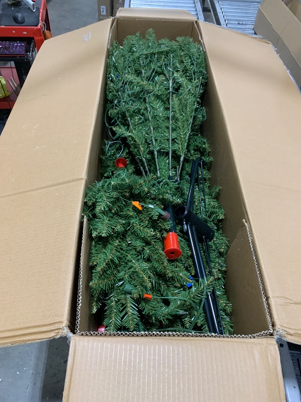 Photo 1 of National Tree Company 7.5 ft Pre-Lit Dunhill Fir Artificial Christmas Tree, 700 LED Lights, 2,514 Tips, Foot Pedal, 10 Light Functions, Includes Stand, Green