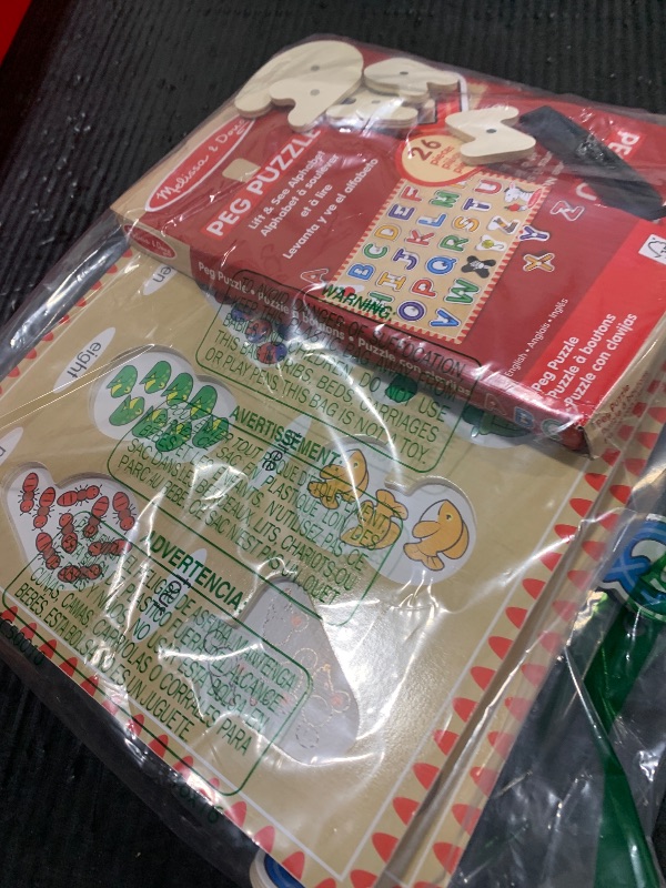 Photo 1 of Melissa & Doug Wooden Lift & See Peg Puzzle Early Learning 2-Pack for Girls and Boys – Alphabet, Numbers