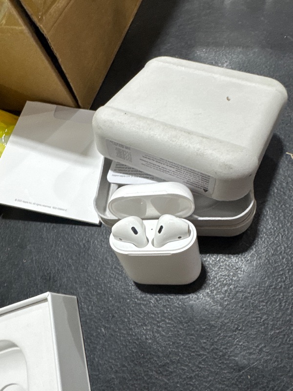 Photo 1 of Apple AirPods Wireless Ear Buds, Bluetooth Headphones with Lightning Charging Case Included, Over 24 Hours of Battery Life, Effortless Setup for iPhone